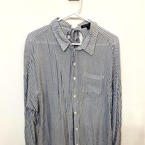 Long sleeve woman’s button up blouse. Light soft material.